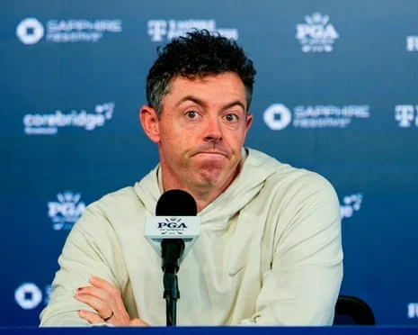 Rory McIlroy shrugs his shoulders at a press conference